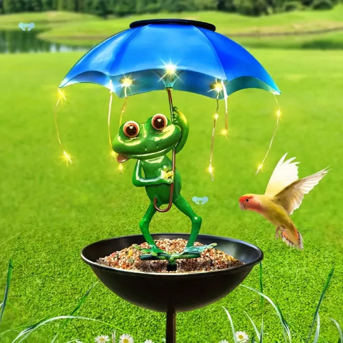 Frog with a blue umbrella and string lights on a grassy background